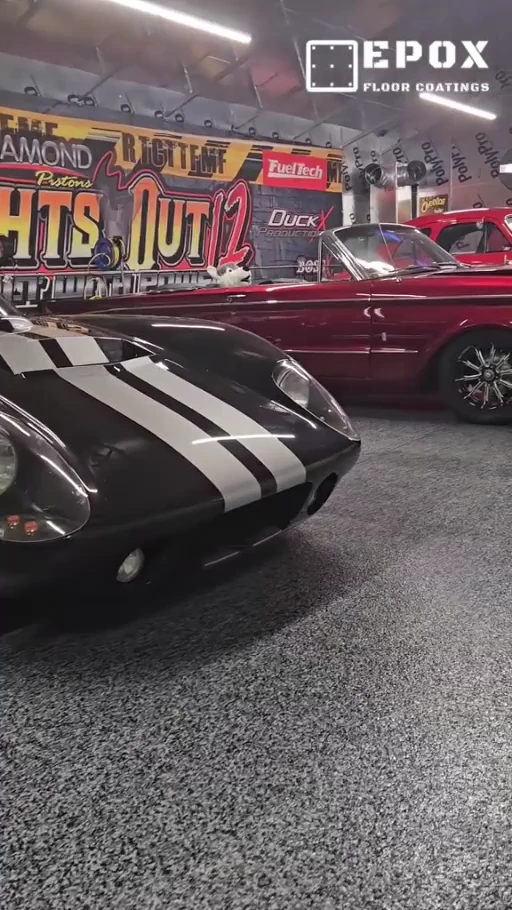 Classic cars displayed on a decorative flake floor installed by EpoX