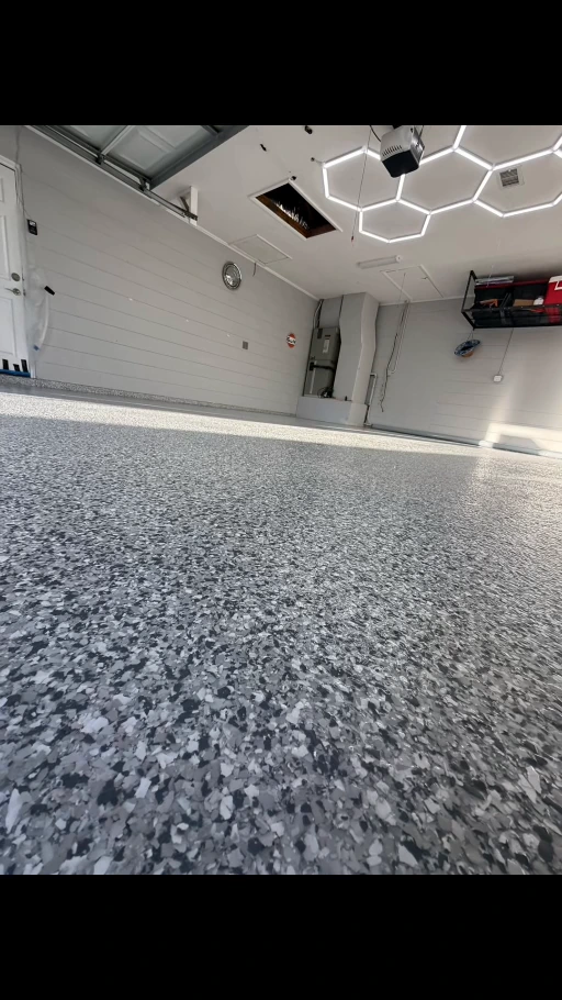 Finished EpoX garage floor with hexagonal ceiling lighting