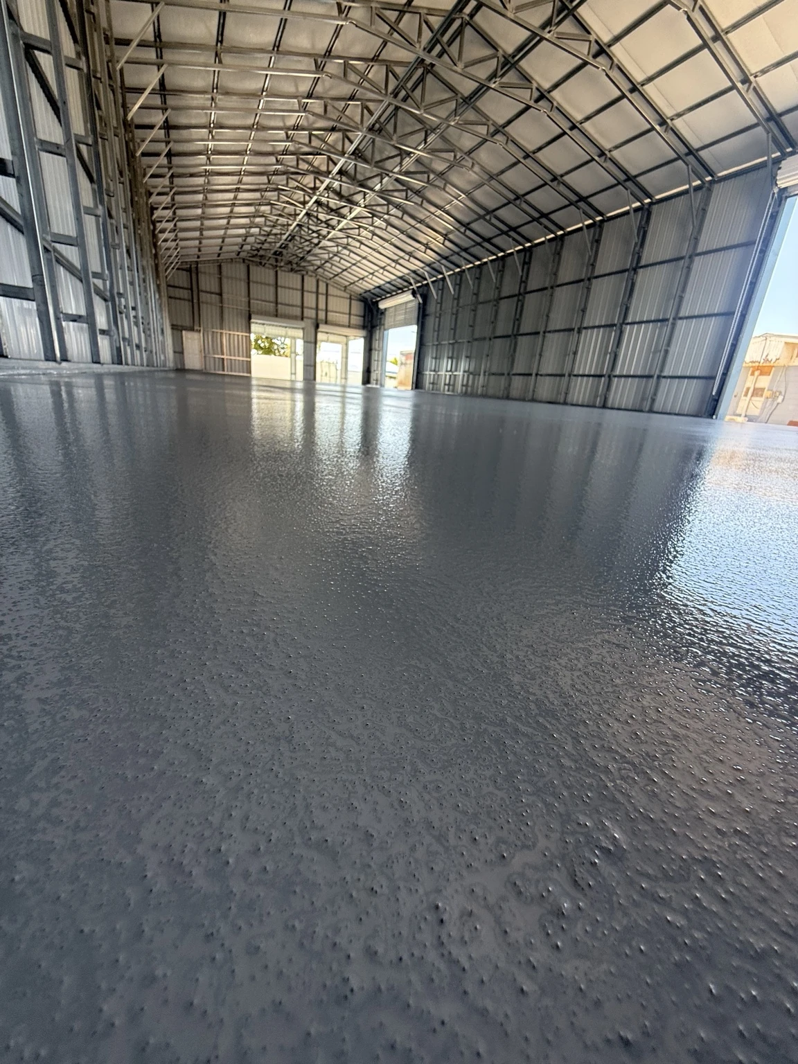 Original EpoX project: medium-gray finished floor inside the Haines City industrial warehouse