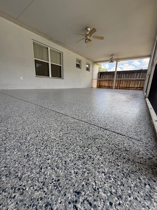 Covered lanai with two ceiling fans and a real EpoX decorative full-flake floor